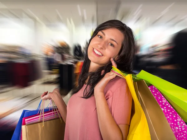 Beautiful woman with a lot of shopping bags — Stock Photo, Image