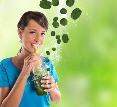 Woman drinking vegetable smoothies. clipart