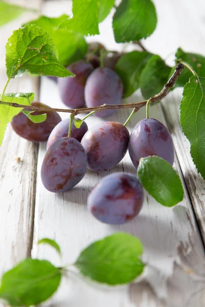Sweet plums on wooden background — Stock Photo, Image