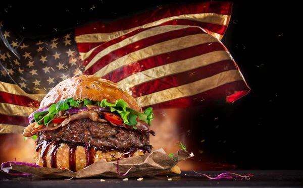 Tasty Burger with Waving American Flag