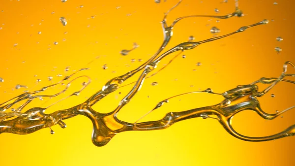 Öl in Wirbelform spritzt — Stockfoto