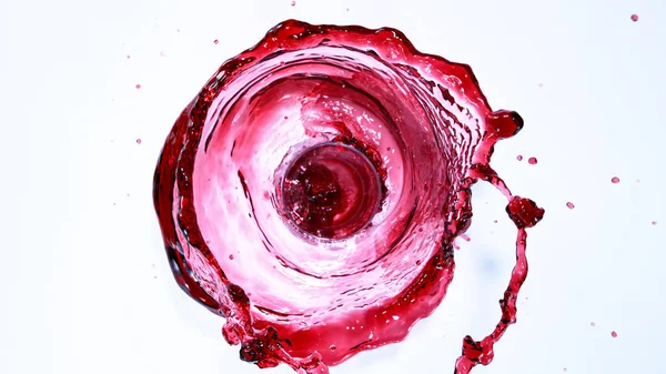 Punaviini roiske eristetty valkoisella pohjalla — kuvapankkivalokuva