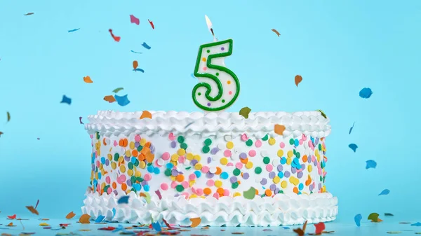 Colorful tasty birthday cake with candles shaped like the number 5. — Stock Photo, Image