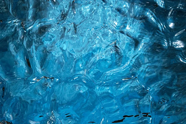Blauw water oppervlak achtergrond, studio shot — Stockfoto