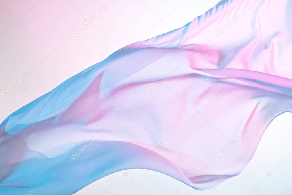 Smooth elegant colorful transparent cloth separated on white background.
