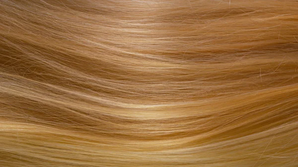 Beautiful healthy long smooth flowing blonde hair. — Stock Photo, Image