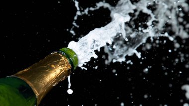 Freeze motion of Champagne explosion with flying cork closure, opening champagne bottle closeup clipart
