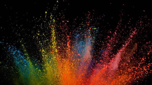 Freeze motion shot of color powder explosion isolated on black background. — Stock Photo, Image