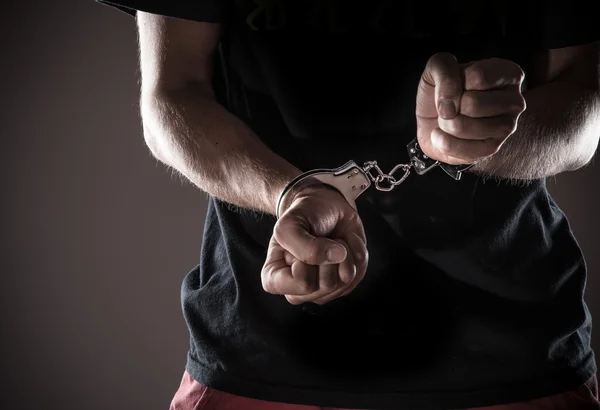 Man handcuffed hands, close-up. — Stock Photo, Image