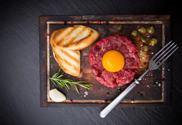 Fresh beef tartar with egg — Stock Photo, Image