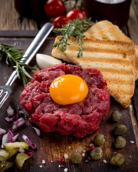 Fresh beef tartar with egg — Stock Photo, Image