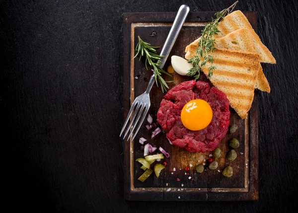 Fresh beef tartar with egg — Stock Photo, Image