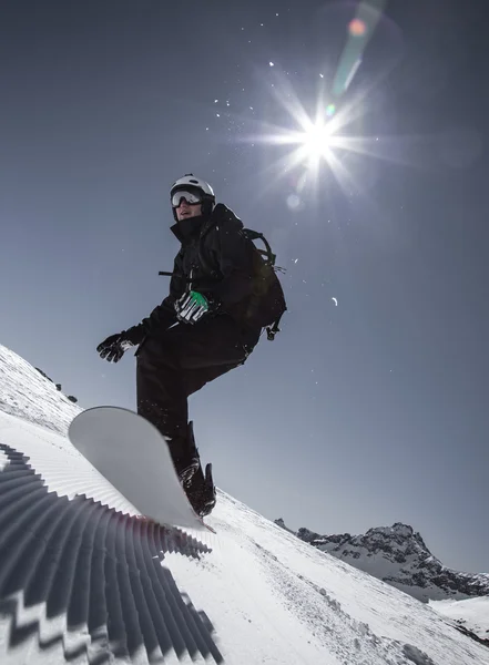 Snowboarder in high mountains — Stock Photo, Image