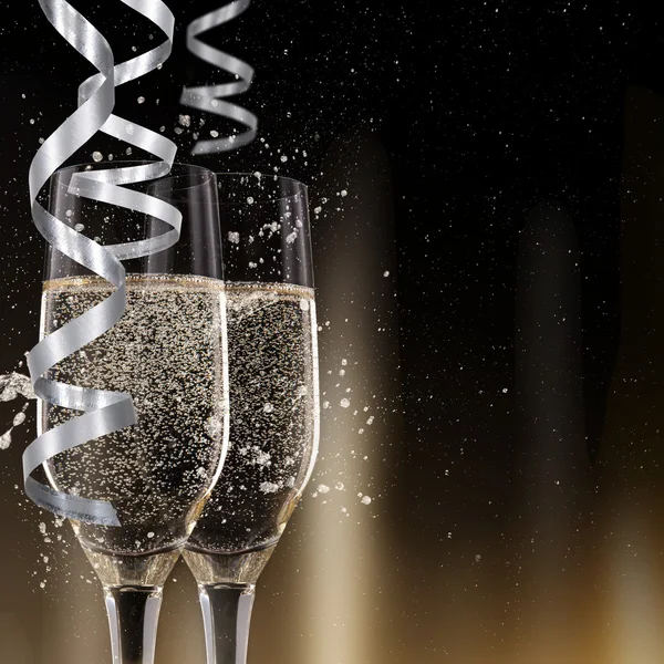 Champagne flutes on black background — Stock Photo, Image