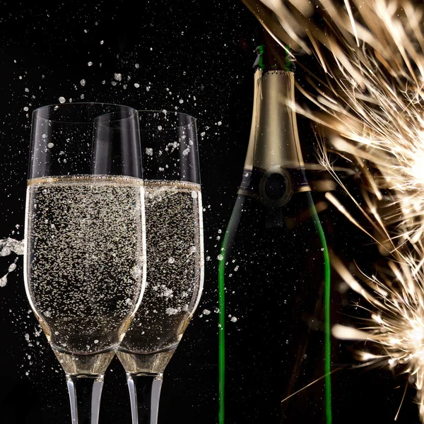 Champagne flutes on black background — Stock Photo, Image