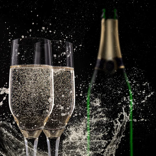 Champagne flutes on black background — Stock Photo, Image