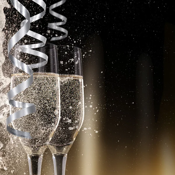 Champagne flutes on black background — Stock Photo, Image