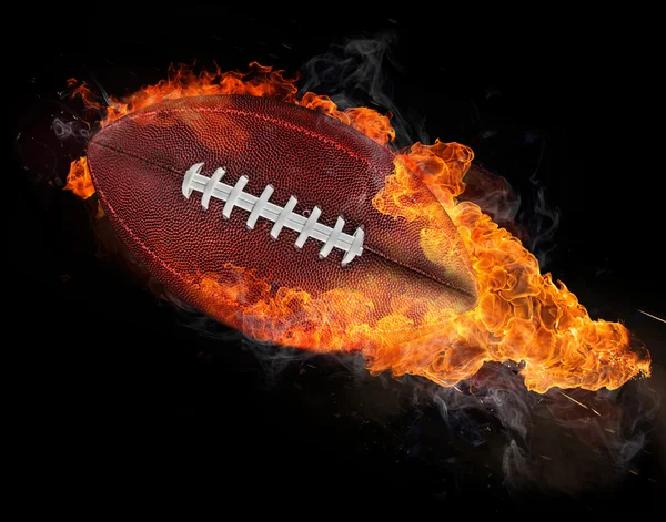 Vliegende rugbybal met vuur vlammen — Stockfoto
