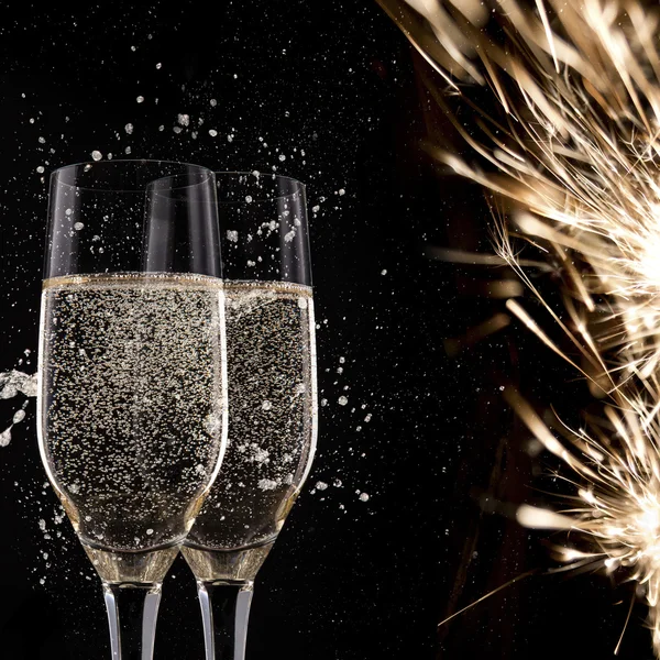 Champagne flutes on black background — Stock Photo, Image