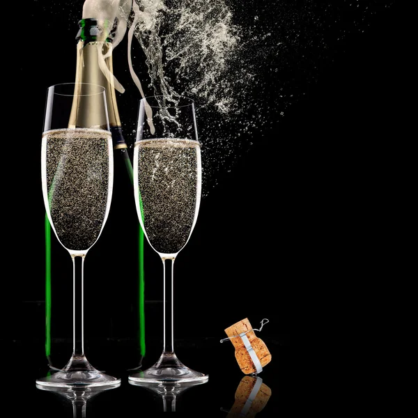 Champagne flutes on black background — Stock Photo, Image