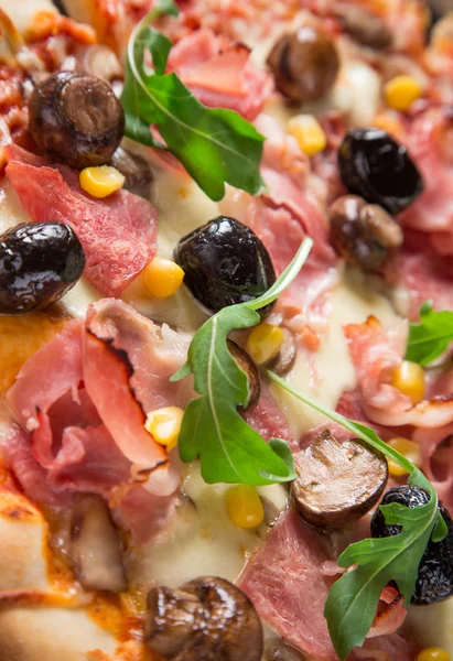 Delicious italian pizza served on wooden table — Stock Photo, Image