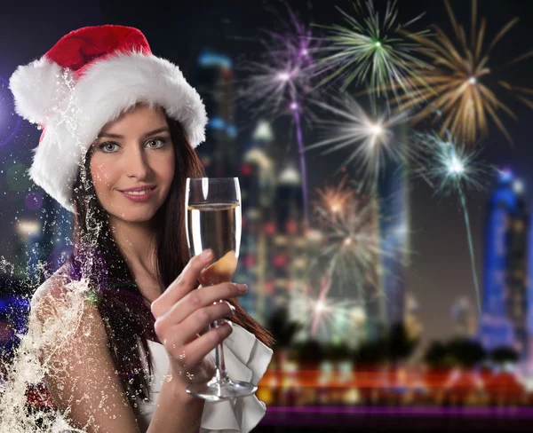 Young Santa girl with champagne glass — Stock Photo, Image