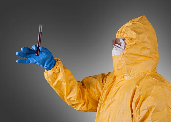 Scientist with protective yellow suit — Stock Photo, Image