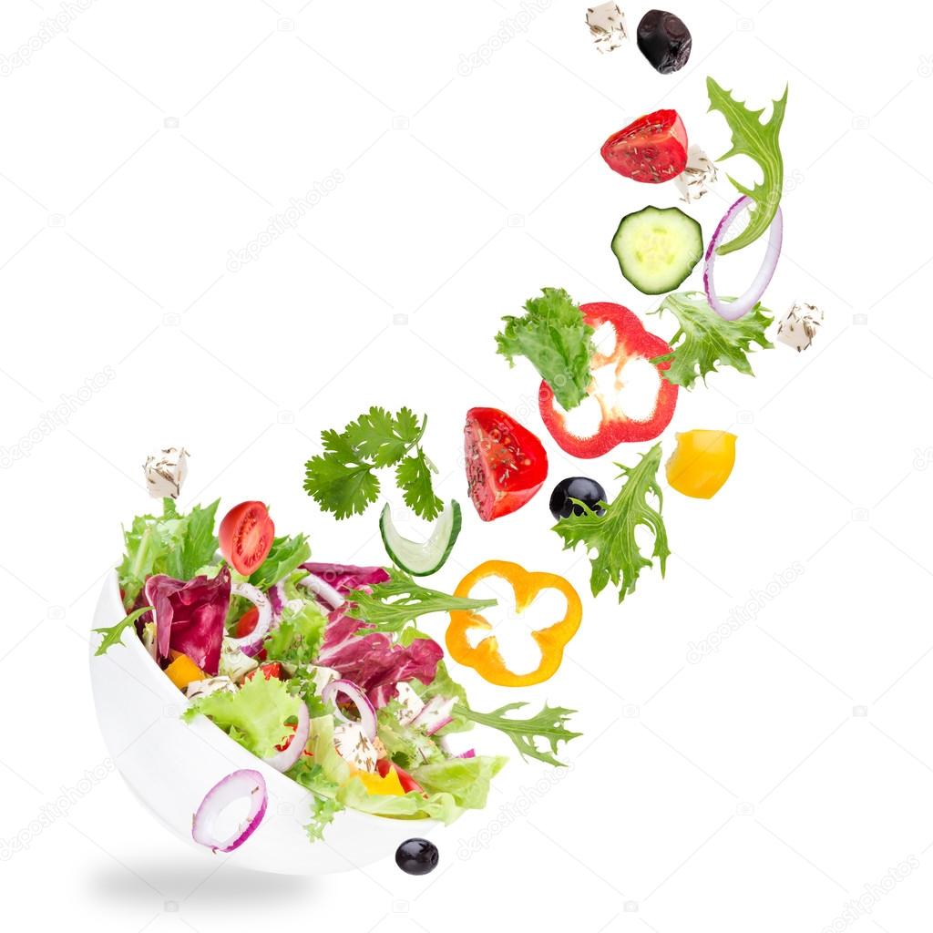 Fresh salad with flying vegetables ingredients