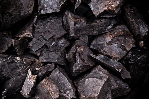 Coal lumps on dark background — Stock Photo, Image