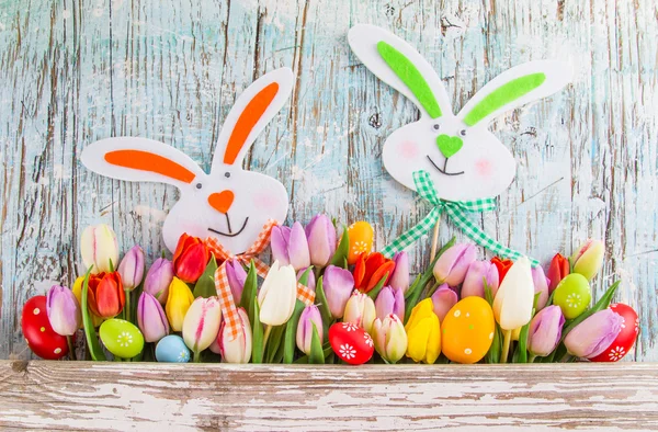 Beautiful bouquet of tulips with easter eggs — Stock Photo, Image
