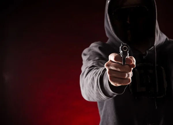 Killer with gun close-up — Stock Photo, Image