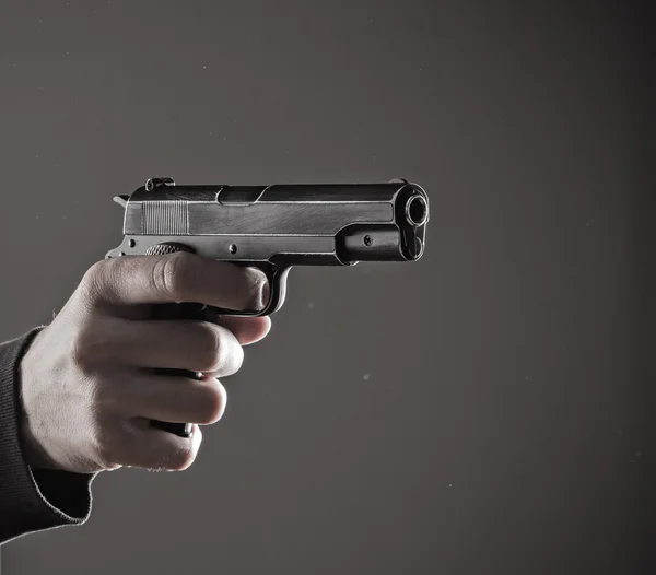 Killer with gun close-up — Stock Photo, Image