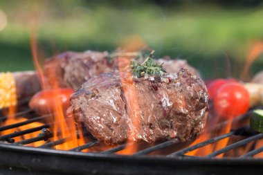 Beef steak on garden grill clipart