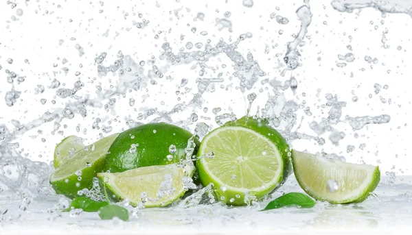 Limes with water splash — Stock Photo, Image