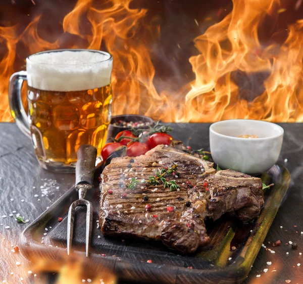 Beef steak on wooden table Royalty Free Stock Images