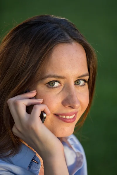 Beautiful brunette girl with smartphone — Stock Photo, Image