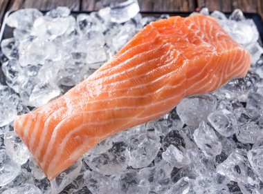 Delicious salmon steak on stone table