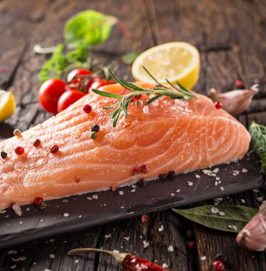 Delicious salmon steak on stone table