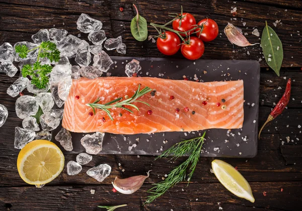 Delicious salmon steak on stone table — Stock Photo, Image