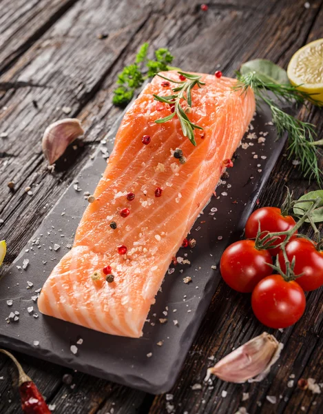 Delicious salmon steak on stone table — Stock Photo, Image