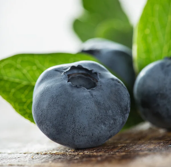 Blueberries on wooden table — Stock Photo, Image