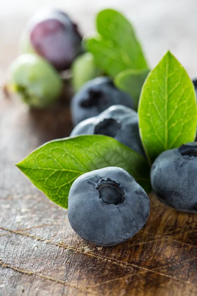 Blueberries on wooden table — Stock Photo, Image