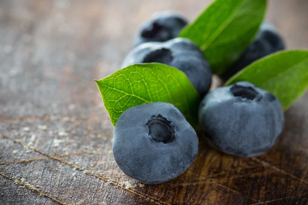 Blueberries on wooden table — Stock Photo, Image