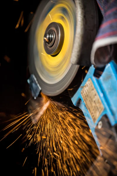Grinding machine in action with bright sparks. — Stock Photo, Image