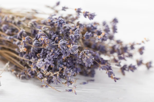 Lavender flowers on wooden table. — Stock Photo, Image