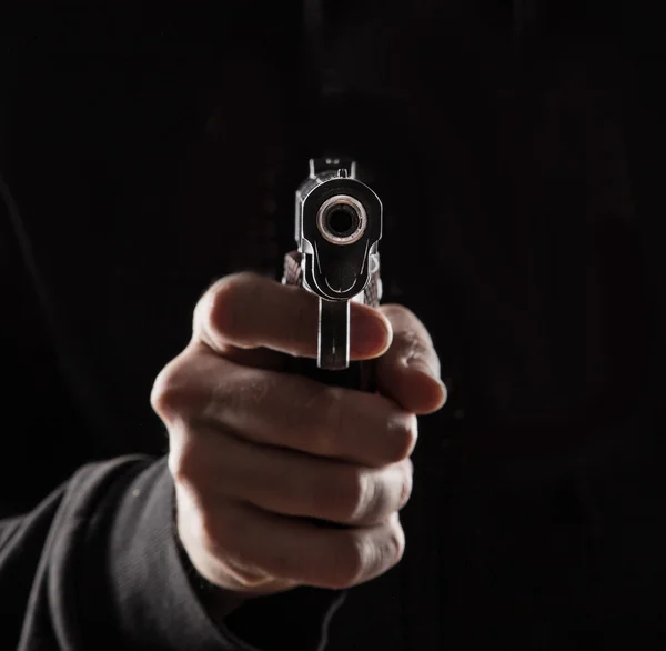 Fotos de Asesino con pistola de cerca de stock, Asesino con pistola de  cerca imágenes libres de derechos | Depositphotos®