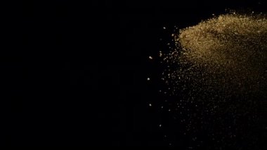 Uçan Kum 'un Süper Yavaş Çekimi, Siyah Arkaplan' da izole edilmiş, Yüksek Hız Sinema Kamerasında 1000 FPS 'de çekilmiştir.