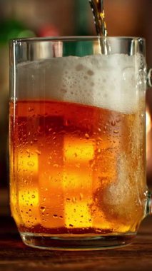 Super Slow Motion of Pouring Beer into Pint Glass, Top Down View. Filmed on High Speed Cinema Camera, 1000 fps.