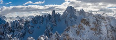 Beautiful Winter Mountain Scenery with Man on Cross-Country Skis