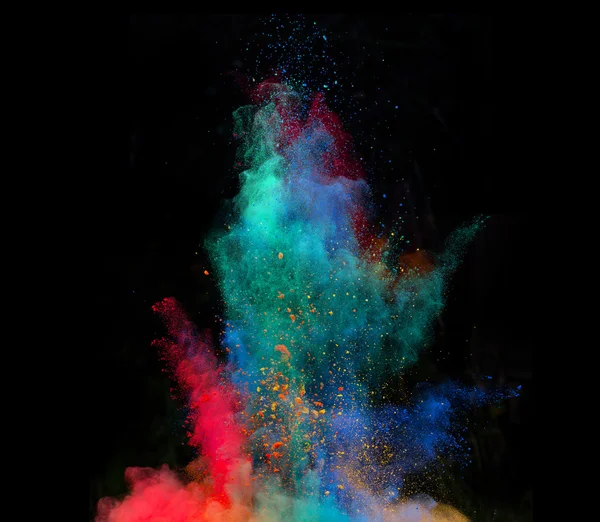 Launched colorful powder on black background — Stock Photo, Image